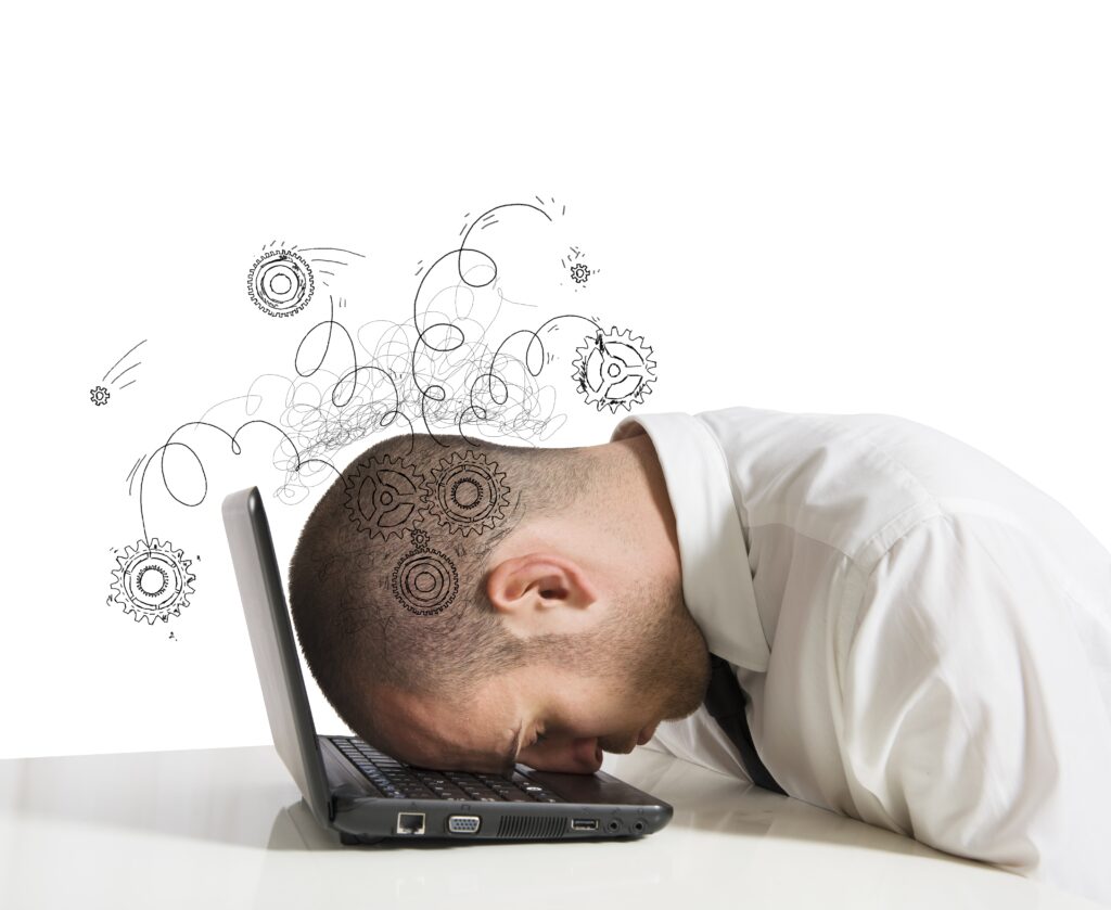 Concept of stress with businessman sleeping on a laptop